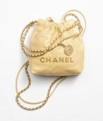CHANEL 22 MINI HANDBAG Shiny Calfskin & Gold-Tone Metal Yellow
