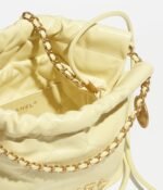 CHANEL 22 MINI HANDBAG Shiny Calfskin & Gold-Tone Metal Light Yellow - Image 4