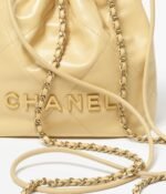 CHANEL 22 MINI HANDBAG Shiny Calfskin & Gold-Tone Metal Yellow - Image 4